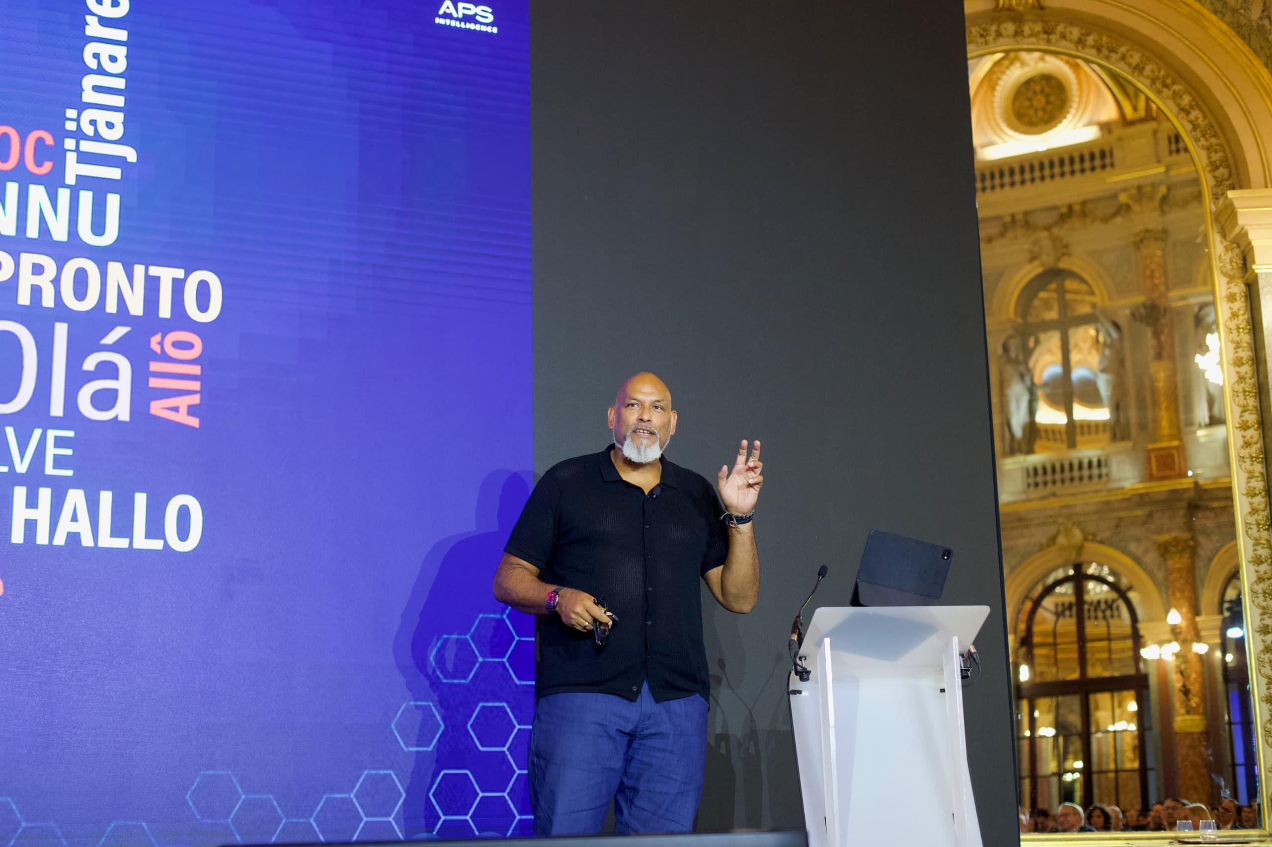John Amaechi delivering a Keynote on <em>The Future of Leadership</em> at The Opera Ballroom of The Intercontinental in Paris (September 2025)